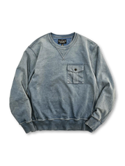 ワックス染めと抜染風加工が施されたデニムブルーカラーのスウェットシャツ