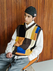 七色パッチワークチェッカーボードVネックベスト、老式12針機織加工の質感と豊かな色ブロックが特徴。