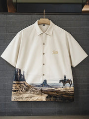 モニュメントバレーの風景と騎馬者がプリントされたキューバシャツ