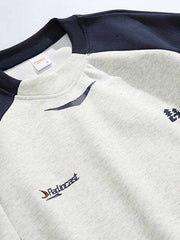 詳細画像: カラーブロックパッチと胸部ディテールの特写