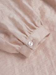 詳細画像: テンセルセットアップの詳細図。チャイナボタンとハイウエストショートパンツのデザインを表示。