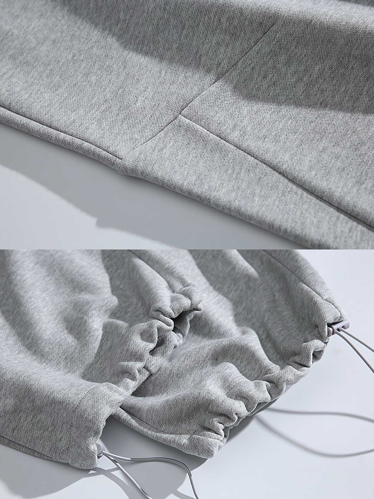 製品画像: 4色展開 カジュアル スウェットパンツ。裏起毛素材とルーズフィットデザインを採用した、冬に最適な厚手スウェットパンツの正面全体展示図。
詳細画像: 柔らかい裏起毛素材の質感と、冷気を防ぐ裾のリブデザインのディテールクローズアップ。