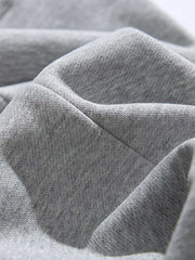 製品画像: 4色展開 カジュアル スウェットパンツ。裏起毛素材とルーズフィットデザインを採用した、冬に最適な厚手スウェットパンツの正面全体展示図。
詳細画像: 柔らかい裏起毛素材の質感と、冷気を防ぐ裾のリブデザインのディテールクローズアップ。