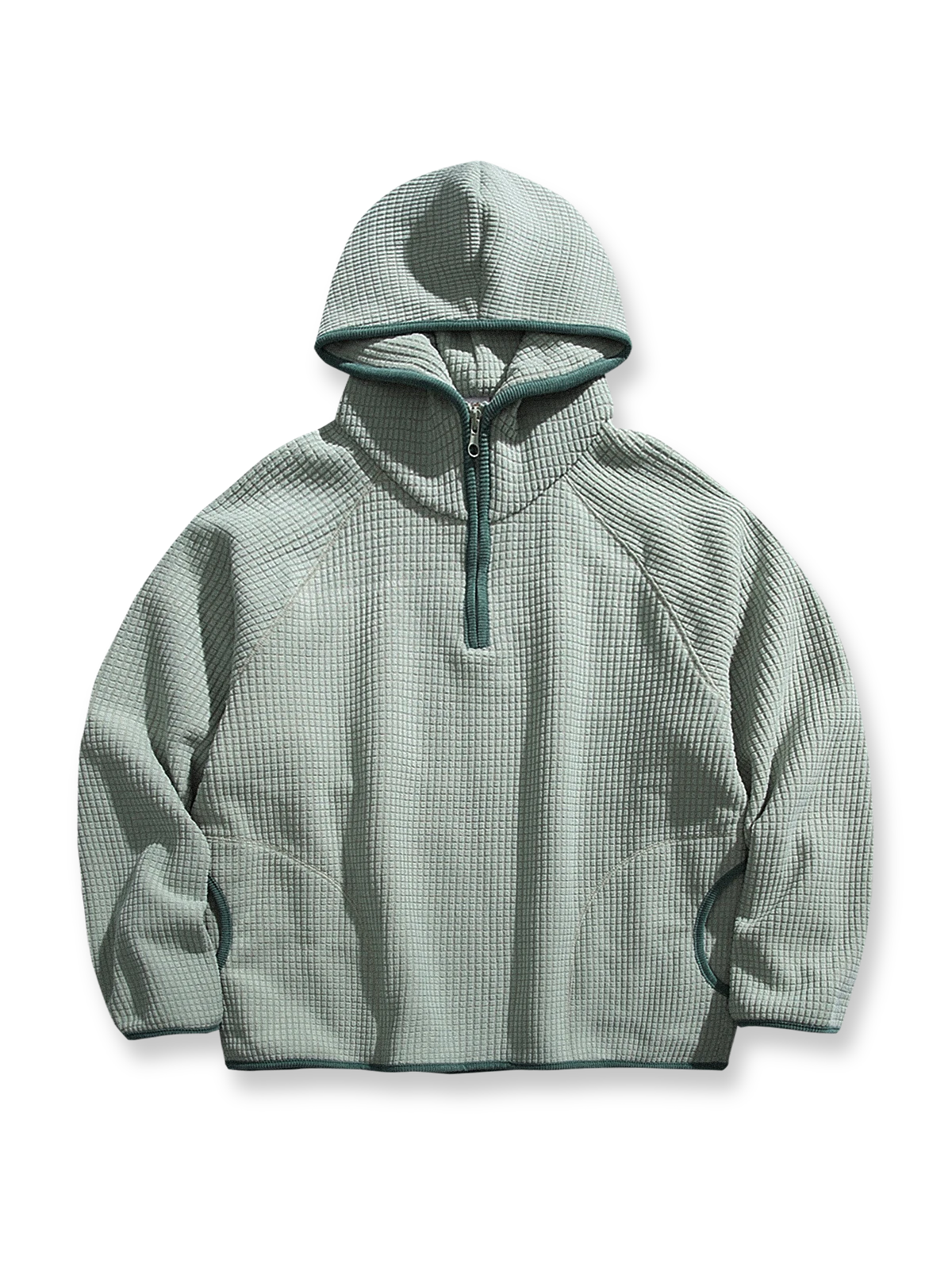 製品画像: 厚手ワッフル織りフード付きスウェット、ヴィンテージ感のあるデザインと裏起毛素材。寒い季節にぴったりの保温性を提供し、快適な着心地。
詳細画像: ワッフル織り生地と裏起毛のディテール。温かみのある厚手素材が、秋冬のコーディネートに最適。