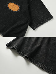 製品画像:
「ウォッシュ加工 パッチワーク 半袖Tシャツの正面展示。ヴィンテージ加工と遊び心あふれるパッチワークデザインが特徴のTシャツ。」
詳細画像:
「パッチワークデザインとウォッシュ加工のディテール特写。視覚的なアクセントとして、ユニークなディテールが際立っています。」