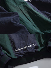 製品画像: バイカラー パッチワーク ハーフジップ ワイドシルエット プルオーバージャケット、軽量で防風性と通気性を備えたデザイン。レトロなカジュアルスタイルにぴったりの日常やアウトドア向けジャケットの正面全体展示図。
詳細画像: クラシックなバイカラーパッチワークとスムーズな着脱を可能にするハーフジップ仕様、伸縮性のある袖口の防風ディテールクローズアップ。