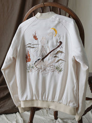 ジャケットのディテールショット、高級ポリエステル素材と美しい刺繍工芸を展示