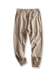 製品画像: 日系スタイルのピュアリネンルーズジョガーパンツ
詳細画像: 柔らかなリネン素材とジョガースタイルのディテール