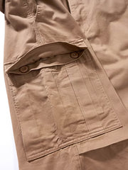 製品画像: タイガーストライプ迷彩M65カーゴパンツの平置き画像
詳細画像: カーゴパンツの多機能ポケットとタイガーストライプ迷彩のディテール画像