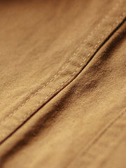 製品画像: ミシガン鉄道ワークジャケットの正面、展示されたウエスタン風とレトロなブロックカラーのデザイン
詳細画像: コーデュロイのブロックポケットと袖口のディテール、ウォッシュ加工とワーク要素を表現