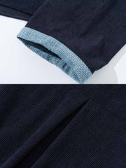 製品画像:コーデュロイ配色タイ付きはんてん風アウターの正面展示。ヴィンテージ感あふれるデザインが特徴。
詳細画像:襟元と袖口の配色デザインとタイ付きディテール。シンプルかつ個性的なデザイン。