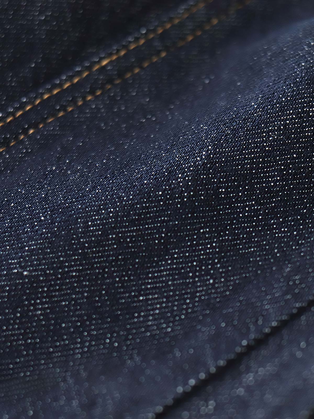 製品画像: リラックスシルエットのテーパードジョガーデニムパンツの全体ビュー
詳細画像: ウエスト部分のドローコードと裾リブデザインのディテール