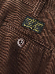 製品画像: "ヴィンテージコーデュロイパンツの正面ビュー、ウォッシュ加工で独特の風合いを持つデザイン"
詳細画像: "コーデュロイの割経起毛とウエストの風紀ボタンデザインの詳細、ヴィンテージ感を演出"