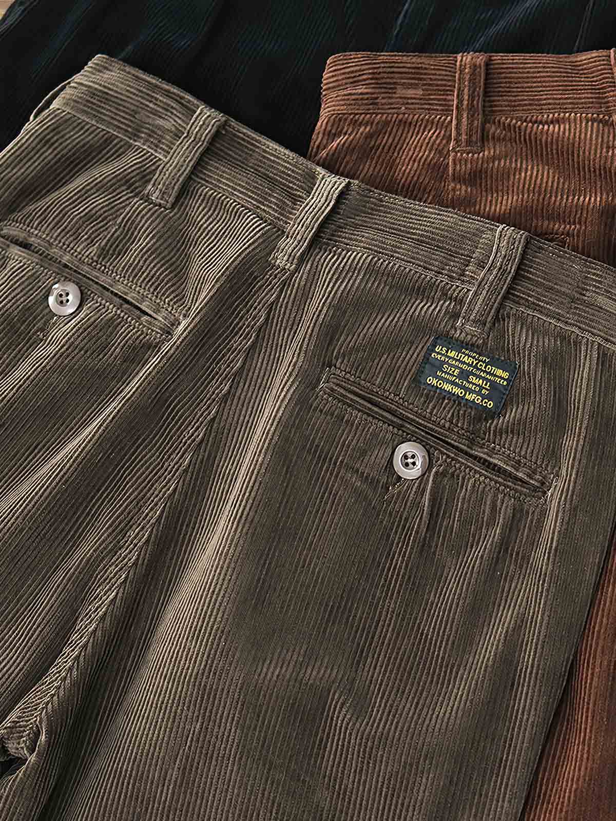 製品画像: "ヴィンテージコーデュロイパンツの正面ビュー、ウォッシュ加工で独特の風合いを持つデザイン"
詳細画像: "コーデュロイの割経起毛とウエストの風紀ボタンデザインの詳細、ヴィンテージ感を演出"