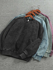 製品画像: ヴィンテージスノーウォッシュクルーネックスウェットのフロントビュー。4色展開で豊富なカラーバリエーションが魅力のデイリースウェット
詳細画像: リブ袖口とスノーウォッシュ加工のディテール。ヴィンテージ感を引き出すトレンドデザイン