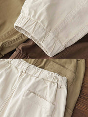 製品画像: ヴィンテージワーク パラシュートジョガーパンツ 正面、ウォッシュ加工とリブウエストデザイン
詳細画像: リブウエストと大きめポケットのディテール、微ストレッチツイル