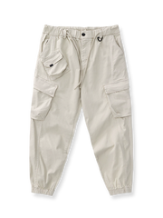 製品画像: ヴィンテージワーク パラシュートジョガーパンツ 正面、ウォッシュ加工とリブウエストデザイン
詳細画像: リブウエストと大きめポケットのディテール、微ストレッチツイル