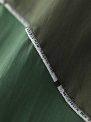 製品画像: レトロ風 配色 フード付き トレーニングジャケット 正面
詳細画像: ハーフジップと反射テープのディテール