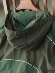 製品画像: レトロ風 配色 フード付き トレーニングジャケット 正面
詳細画像: ハーフジップと反射テープのディテール