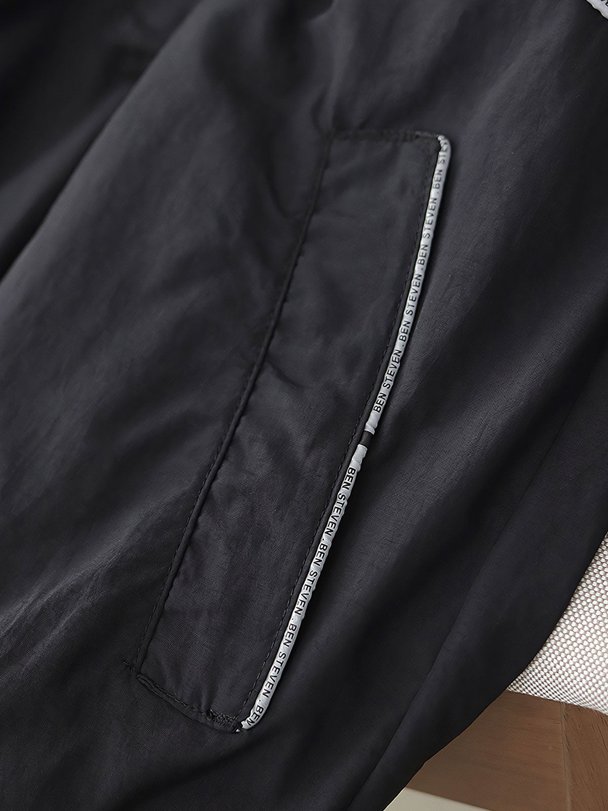 製品画像: レトロ風 配色 フード付き トレーニングジャケット 正面
詳細画像: ハーフジップと反射テープのディテール