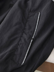 製品画像: レトロ風 配色 フード付き トレーニングジャケット 正面
詳細画像: ハーフジップと反射テープのディテール