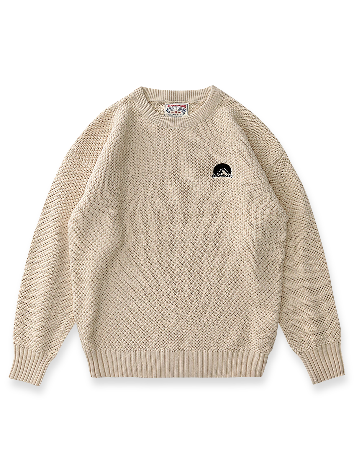 製品画像:ゆったりとしたワッフル編みクルーネックセーターの正面展示。ヴィンテージ風のデザインがカジュアルなスタイルにぴったり。
詳細画像:立体感のあるワッフル編みのディテールをクローズアップ。柔らかさと耐久性を兼ね備えたダブルヤーン素材。