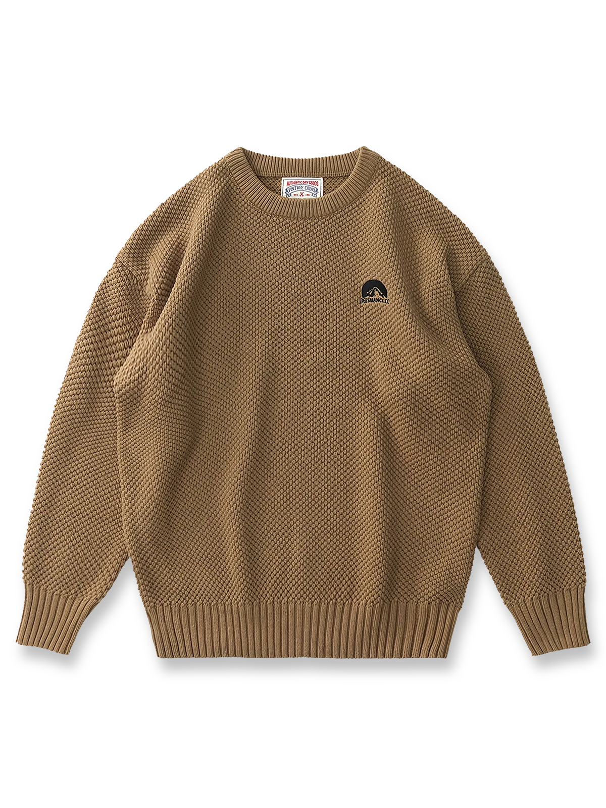 製品画像:ゆったりとしたワッフル編みクルーネックセーターの正面展示。ヴィンテージ風のデザインがカジュアルなスタイルにぴったり。
詳細画像:立体感のあるワッフル編みのディテールをクローズアップ。柔らかさと耐久性を兼ね備えたダブルヤーン素材。