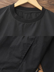 製品画像: 軽量 Cordura ナイロン 速乾トップ 正面、耐摩耗性・リップストップ機能
詳細画像: 両サイドの大容量ポケットと伸縮性のある袖口のディテール、オーバーサイズシルエット