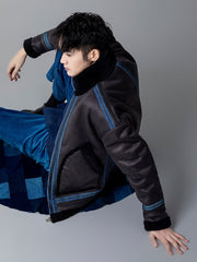 詳細画像: 草木模様のテープパッチワークディテール表示。ヴィンテージ感と高級感を兼ね備えたユニークな仕上がり。
モデル画像: モデル着用による厚手ムートンジャケットのシティスタイル。冬のカジュアルシーンに最適なアウター。