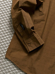 製品画像: 春秋シーズンに最適なコーマコットン製格子織り長袖シャツ全体画像|リラックスフィットで快適なカジュアルスタイル
詳細画像: コーマコットン素材の格子織りディテール|春秋のカジュアルコーディネートに最適な品質感