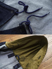 製品画像: デニムバージョンのM51フィッシュテールコート全体イメージ画像。特注のデニム素材で再現されたヴィンテージミリタリースタイルが特徴的。シルバーカラージッパーやブルー樹脂ボタンなど、細部までこだわったデザインが魅力。
詳細画像: YKK製スナップボタンと特注シルバーカラージッパー、ブルー樹脂ボタンのディテールをクローズアップした画像。ヴィンテージ感を引き立てる丁寧なディテールが際立つ。