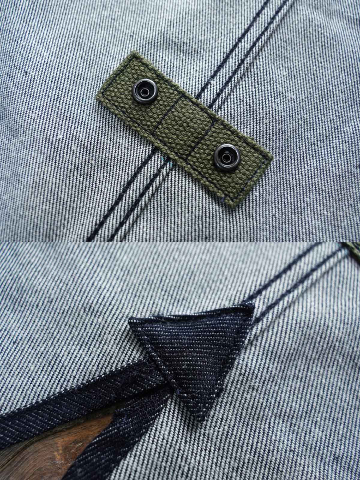 製品画像: デニムバージョンのM51フィッシュテールコート全体イメージ画像。特注のデニム素材で再現されたヴィンテージミリタリースタイルが特徴的。シルバーカラージッパーやブルー樹脂ボタンなど、細部までこだわったデザインが魅力。
詳細画像: YKK製スナップボタンと特注シルバーカラージッパー、ブルー樹脂ボタンのディテールをクローズアップした画像。ヴィンテージ感を引き立てる丁寧なディテールが際立つ。