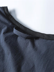 製品画像: リバーシブル撥水・撥油・防汚軽量ダウンジャケットの全体イメージ画像。ホワイトダックダウン90%を使用した中綿と、特別なテフロンコーティングを施した外層が特徴的。グレーベージュとネイビーの両面デザインで、アウトドアから日常コーデまで幅広く活用可能。
詳細画像: 撥水・撥油・防汚加工が施された外層と、軽量ホワイトダックダウン中綿をクローズアップしたディテール画像。耐久性と保温性を兼ね備えた素材が際立つ。