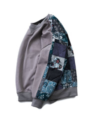 製品画像: 伝統的な民族風の柄と現代的なデザインが融合したユニークなパッチワークスウェット。前後切り替えデザインが特徴で、カジュアルでありながらトレンド感のある一着。
詳細画像: 袖部分の民族風パッチワークと豊かな層感がアクセントとなり、視覚的インパクトを与えるパッチワークスウェット。ゆったりとしたルーズフィットが快適な着心地を提供します。