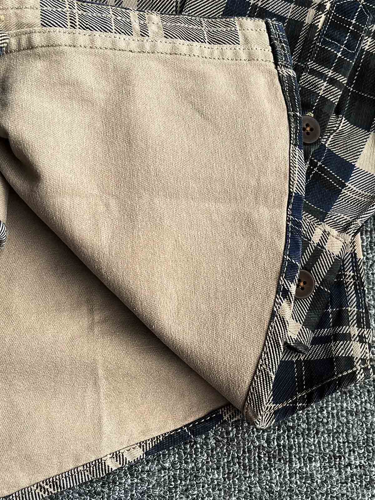 製品画像
「ヴィンテージ感あふれるクラシックなアメカジハードボイルドスタイルを再現した長袖チェックシャツ全体画像。100%コットン素材と立体的なシルエットが特徴。」
詳細画像
「高密度織りのチェック柄生地と胸ポケットのディテールをクローズアップ。ヴィンテージ調の配色とシャツの質感が際立つ画像。」