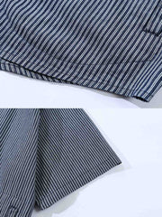 シャツのディテール展示(ストライプパッチワークと刺繍デザイン)