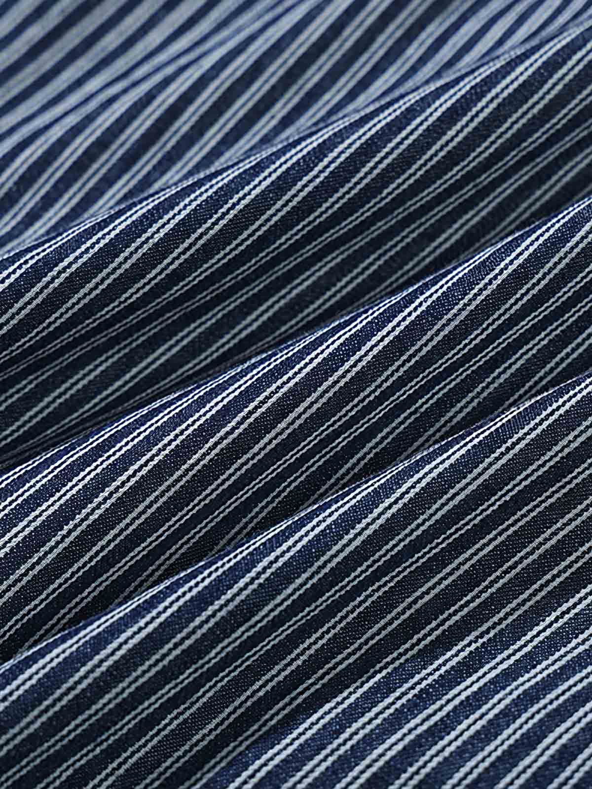 シャツのディテール展示(ストライプパッチワークと刺繍デザイン)