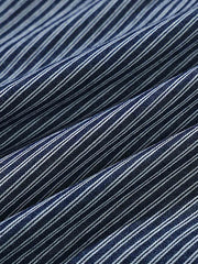 シャツのディテール展示(ストライプパッチワークと刺繍デザイン)