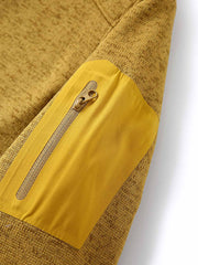 製品画像
「9色展開のスタンドカラーフリースジャケットの全体展示画像。高い透湿性と保温性を兼ね備え、スタンドカラーデザインが防風性と首元の立体感を引き立てるジャケット。多孔構造、ポーラス構造、マイクロポーラス膜技術、透湿性、保温性、防風、9色展開。」
詳細画像
「スタンドカラーフリースジャケットのスタンドカラー部分と袖口のディテールを特写。防風性と保温性を高めるデザインが際立ち、柔らかな起毛素材と立体メッシュ素材の構造が確認できる。スタンドカラー、防風デザイン、保温性、起毛素材、立体メッシュ、多孔構造、ディテール特写。」