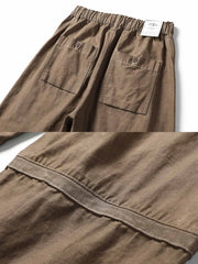 膝部分の補強ステッチと裾のドローストリングをクローズアップ