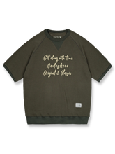 アメリカンレトロスタイルのワッフル格子模様のラグランスリーブ半袖Tシャツの正面ビュー。ネックラインに三角形の補強が施され、レトロなデザインが際立っています。