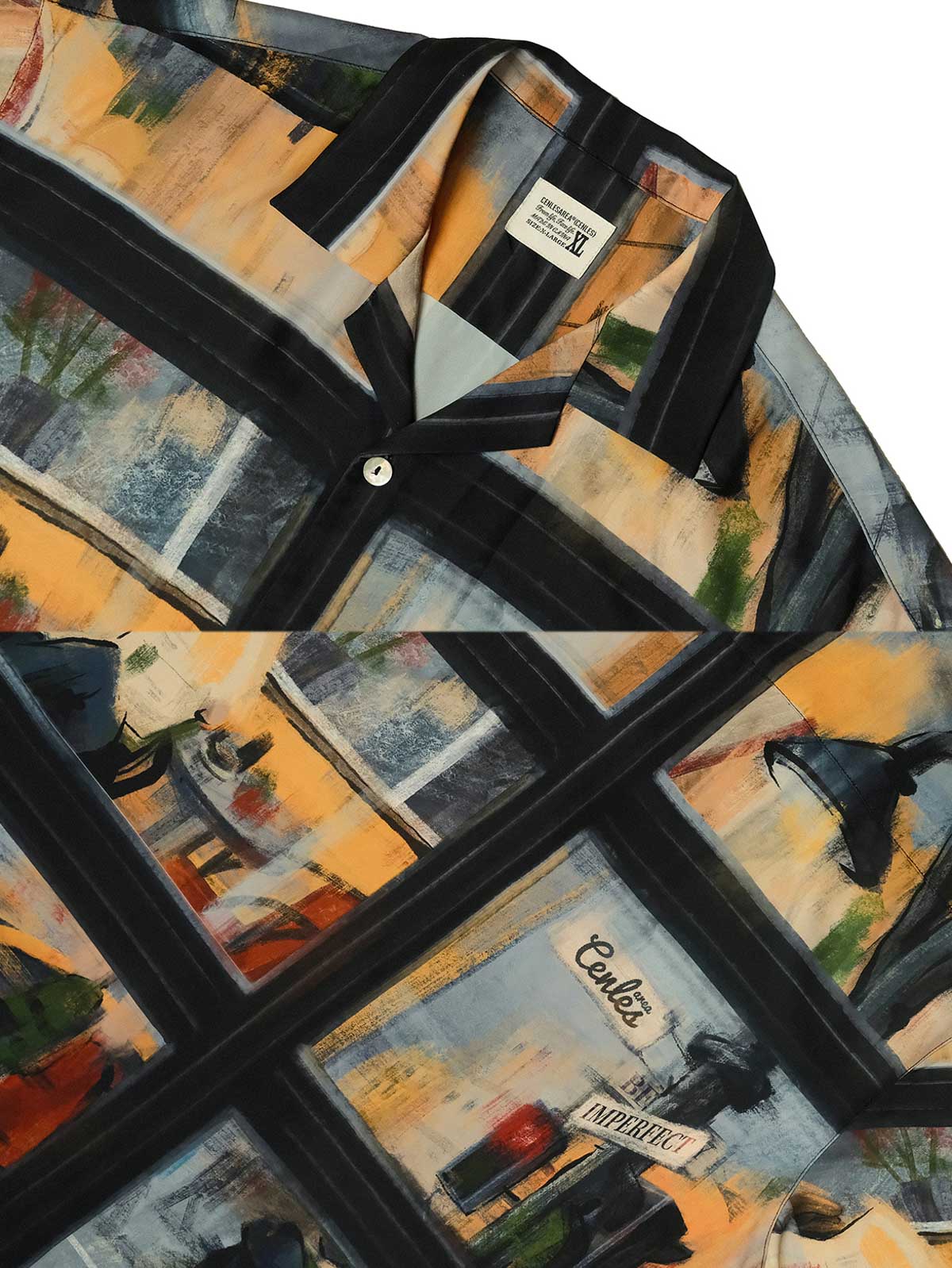 ハワイアンシャツの高精度デジタルプリントのクローズアップ。明瞭で色鮮やかな街景画と天然貝ボタンが、アート作品のようなデザインを際立たせています。