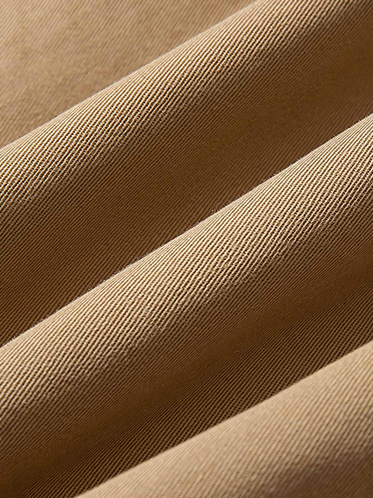 製品画像: ドレーピング(立体裁断)技法を活かしたスタンドカラーのワークジャケット全体展示、サンドウォッシュ加工とコーマコットン素材を使用したヴィンテージ感のあるデザイン
詳細画像: ドレーピングカットによる立体感、スタンドカラーのディテール、大容量ポケットのクローズアップ