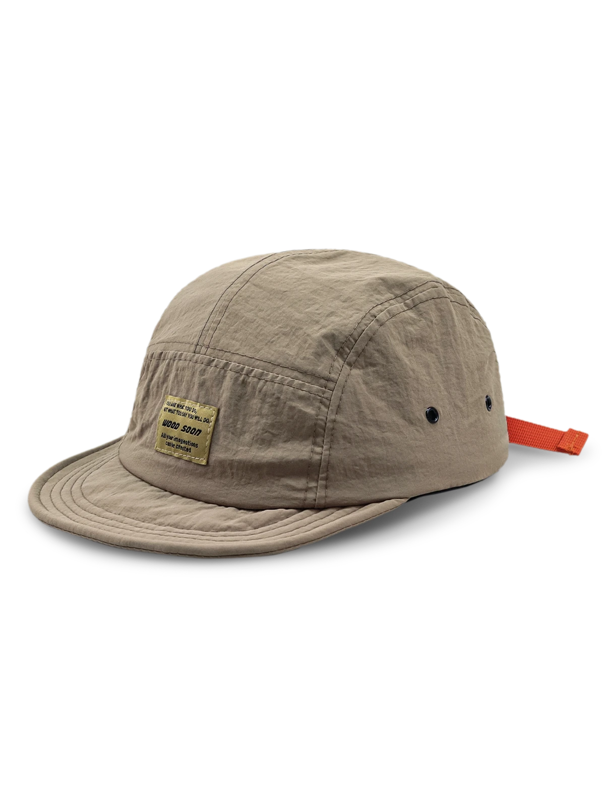 エクスプローラーハットの通気孔とオレンジ色のプルタブのクローズアップ、耐摩耗性に優れたナイロン素材。