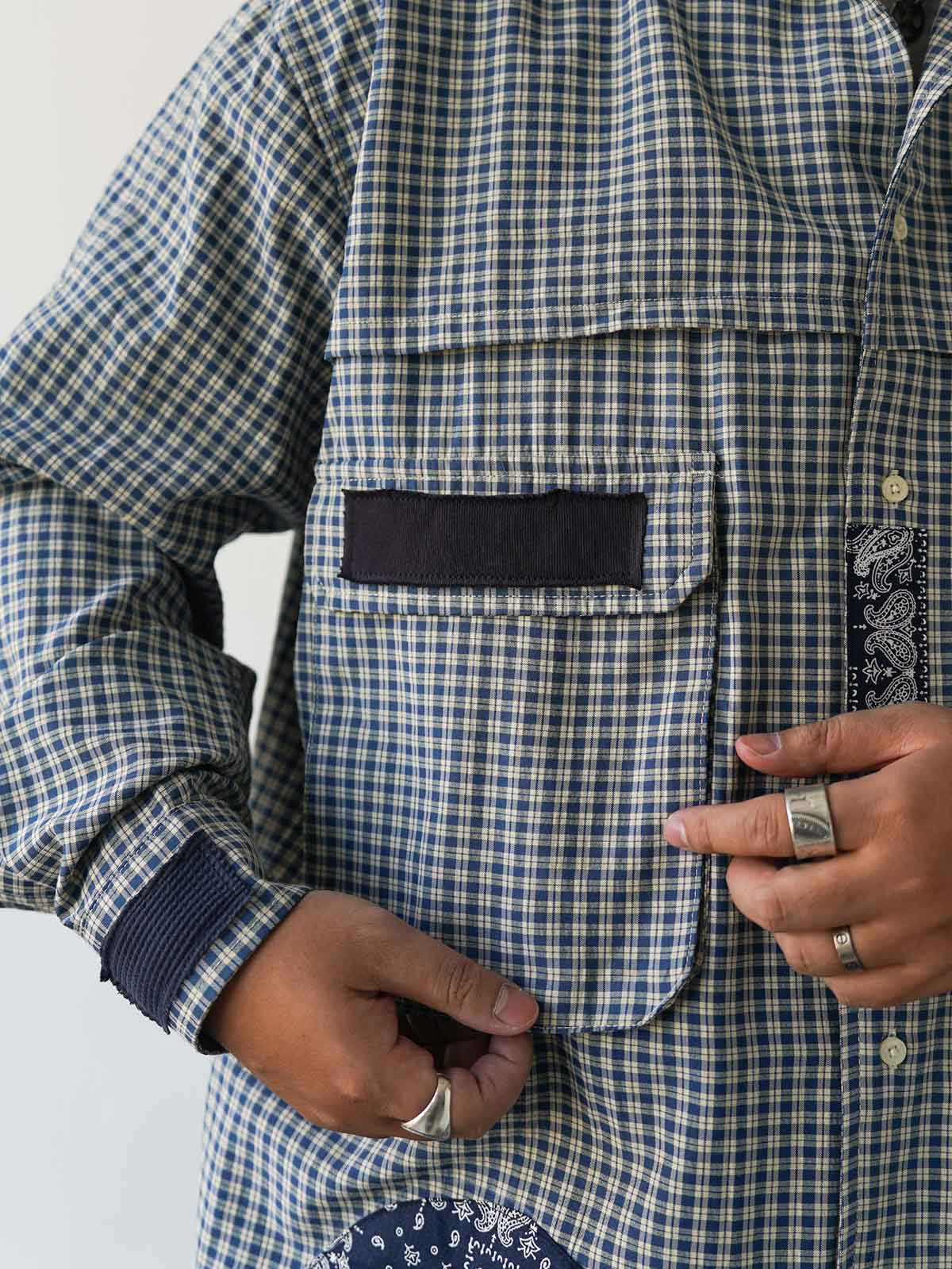 詳細画像
ダブルチェストポケットや肩部分の二重構造のディテール、3cmあたり18針の高密度ステッチが丁寧に仕立てられた特写。耐久性と立体感を両立した洗練された仕上がり
モデル画像
ボロパッチワーク ワークシャツを使用したリラックス感のあるスタイリング例。アメリカンワークウェアの力強さと日本刺し子芸術の繊細さを融合させたワークウェアスタイルが特徴的