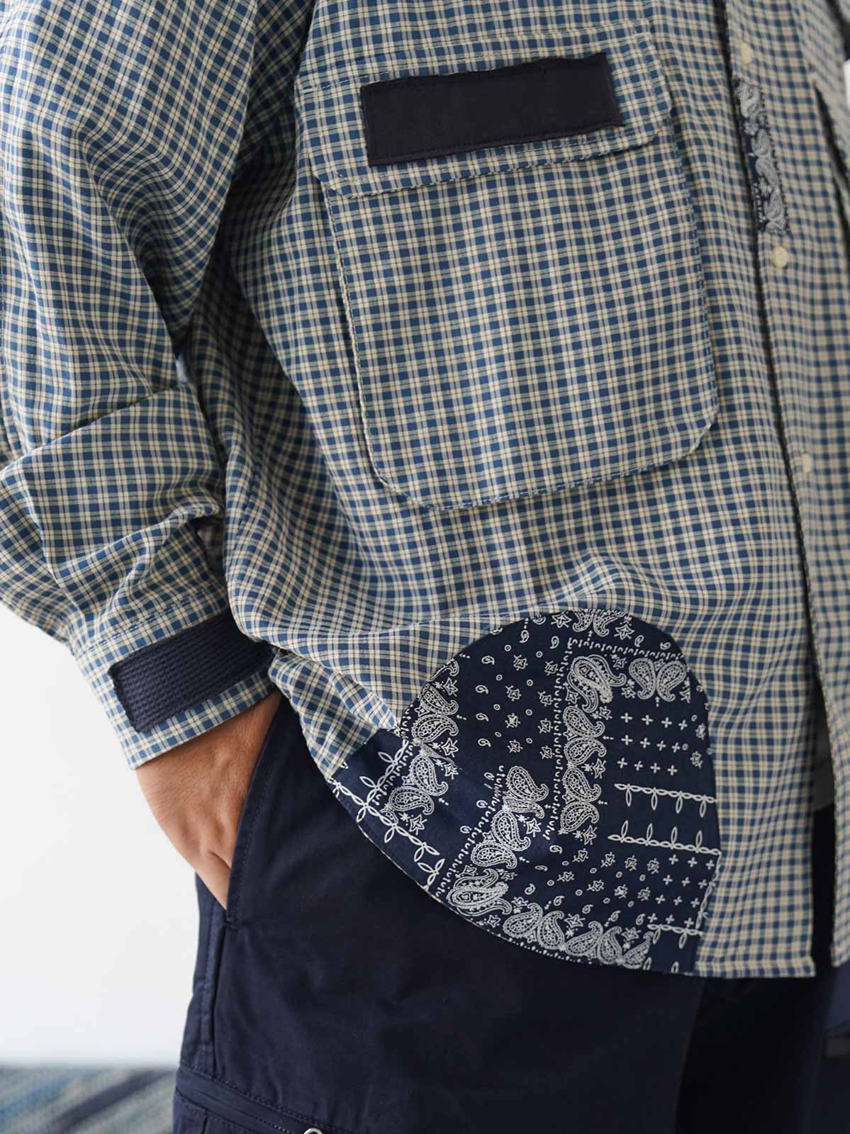 詳細画像
ダブルチェストポケットや肩部分の二重構造のディテール、3cmあたり18針の高密度ステッチが丁寧に仕立てられた特写。耐久性と立体感を両立した洗練された仕上がり
モデル画像
ボロパッチワーク ワークシャツを使用したリラックス感のあるスタイリング例。アメリカンワークウェアの力強さと日本刺し子芸術の繊細さを融合させたワークウェアスタイルが特徴的