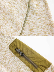 製品画像
「ミニマルなパッチワークデザインと高性能素材が融合したパッチワークヘビージャケットの全体展示画像。保温性、防風性を備え、寒冷な天候でも軽やかに対応できるデザインが特徴。」
詳細画像
「ジッパーポケットとパッチワークデザインのディテール特写。袖部分のジッパーポケットが実用性を高め、ダブルジッパー仕様により着脱が容易で、視覚的なアクセントとしてバイカラーのパッチワークが際立つ。」