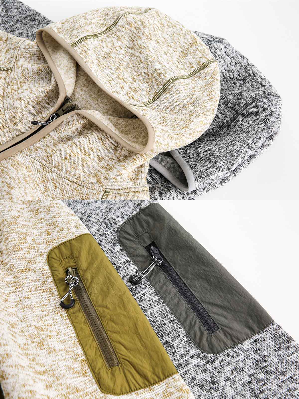 製品画像
「ミニマルなパッチワークデザインと高性能素材が融合したパッチワークヘビージャケットの全体展示画像。保温性、防風性を備え、寒冷な天候でも軽やかに対応できるデザインが特徴。」
詳細画像
「ジッパーポケットとパッチワークデザインのディテール特写。袖部分のジッパーポケットが実用性を高め、ダブルジッパー仕様により着脱が容易で、視覚的なアクセントとしてバイカラーのパッチワークが際立つ。」