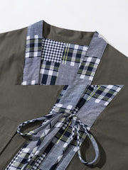 製品画像: リバーシブル チェック柄 はんてん。クラシックなチェック柄と無地デザインを組み合わせた、多用途で実用的なはんてんの全体展示図。
詳細画像: ヴィンテージ感あふれるチェック柄のディテールと、実用性を高めるウエストのドローコードデザインのクローズアップ。