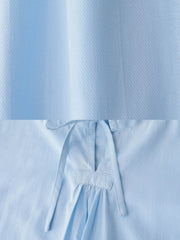 ラウンドネックのドローコードと非対称な裾のディテール。